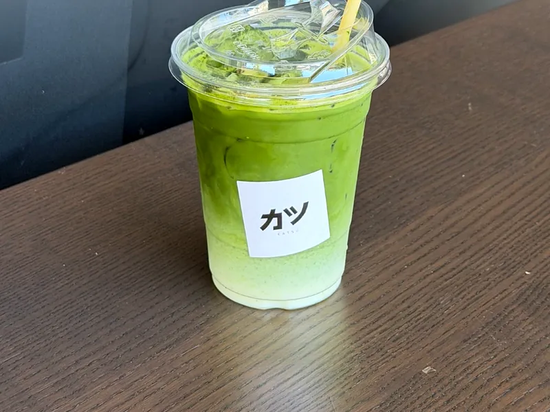 An iced jasmine matcha with the Katsu sticker on the cup