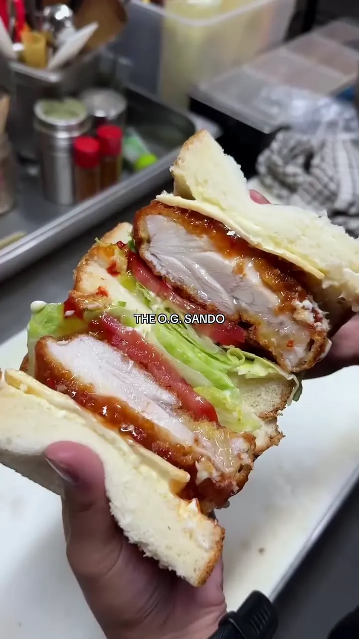 The OG Sando pulled apart: juicy chicken katsu, lettuce, tomato and cheese with sweet chilli mayo